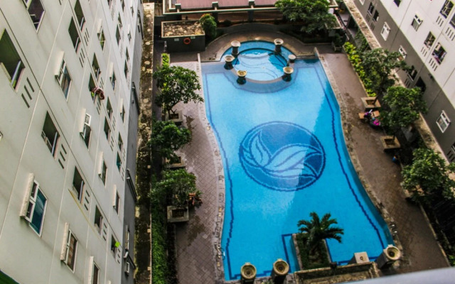 Comfortable and Tranquil 2BR Apartment at Green Pramuka By Travelio