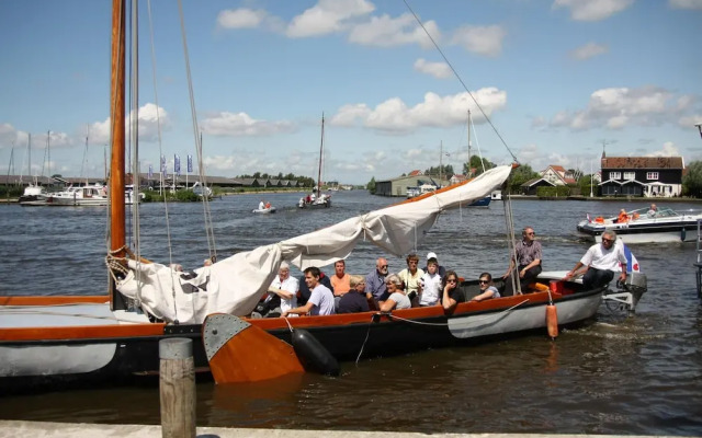Nice Holiday Home on the Water in Grou