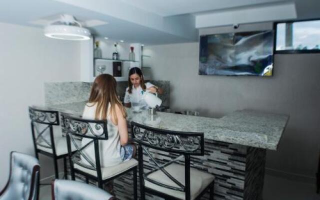 Malecon Rooms y Hotel