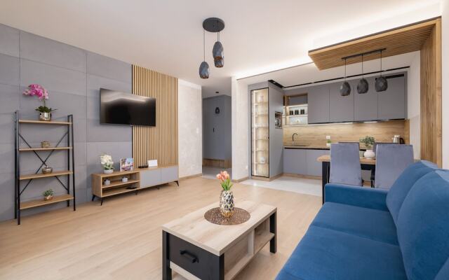 Dark Blue Apartment in Kraków by Renters