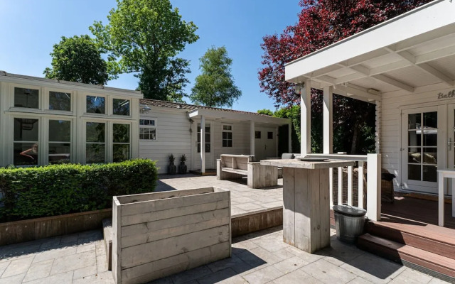 Chalet Kieftveen With hot tub for Four Person