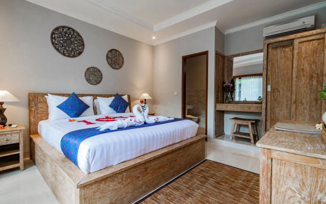 Ayu Sari Guesthouse by Mahaputra