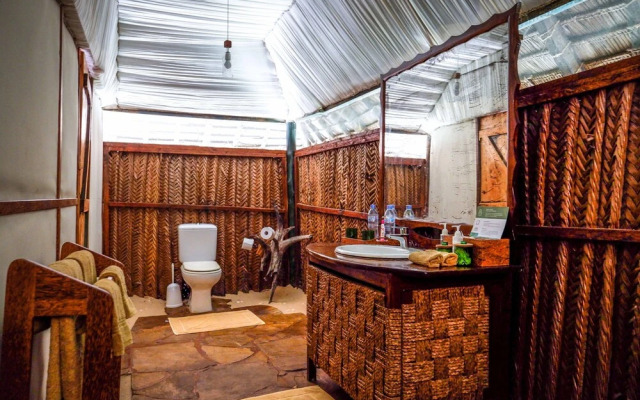 Saadani Safari Lodge - bush, river, beach