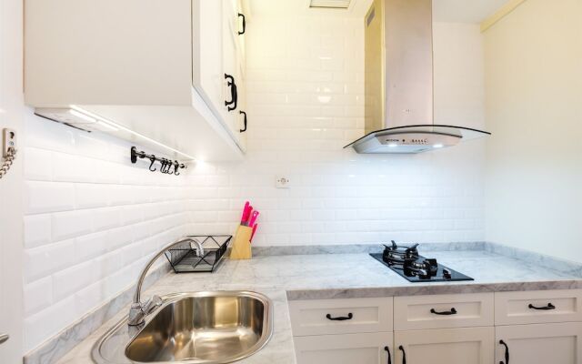 Minimalist Studio at Bassura City Apartment By Travelio