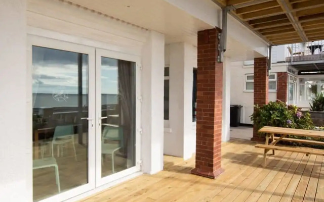 Absolute Beachfront With Decked Garden Oasis and Views