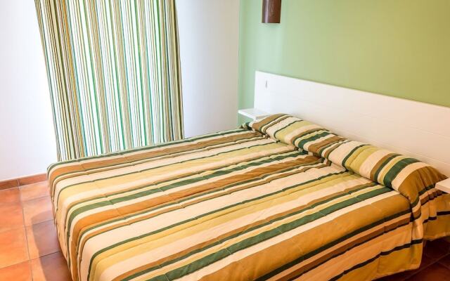 Spacious apartment with terrace surrounded by pine trees