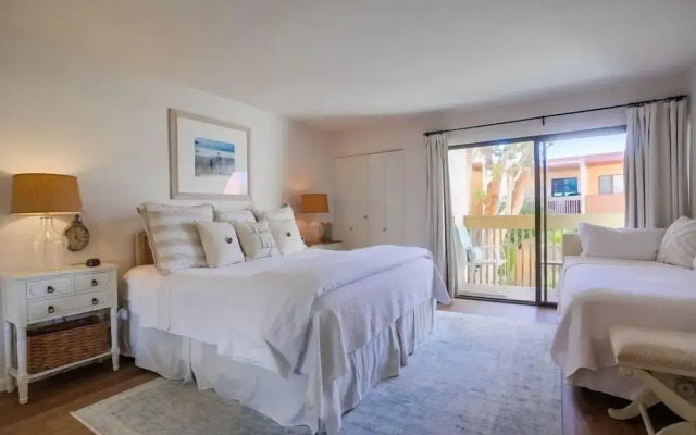 Coastal Chic Furnishings Condo Steps to Beach SBTC 128 by RedAwning