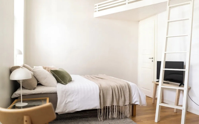 A bright wooden studio for four