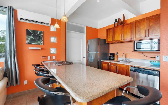 Modern Top-Floor Condo with Panoramic Views and Community Pool