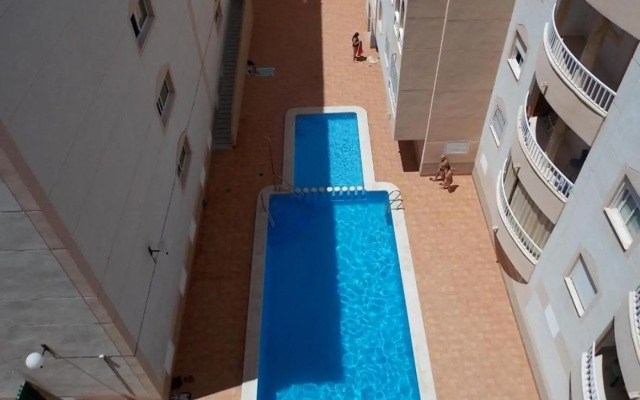 apartamento soleado, 1 dormitorio con balcón, piscina y garage