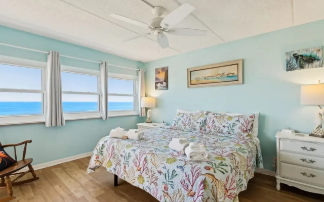 Oceanfront Beach Condo with Private Balcony, Short Walk to Pool and Beach by RedAwning