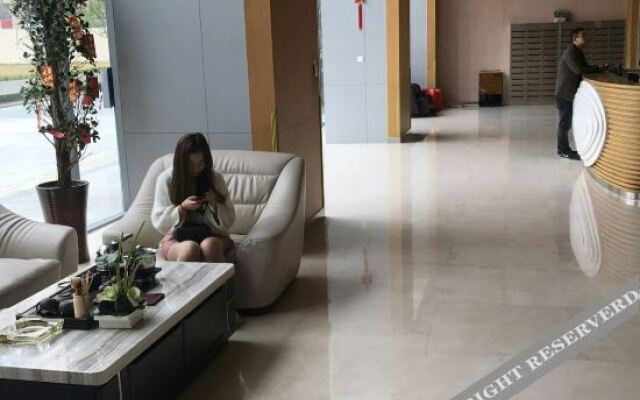 Xinyueju Boutique Apartment (Shishi Clothing City Shimao Skyscraper City Branch)