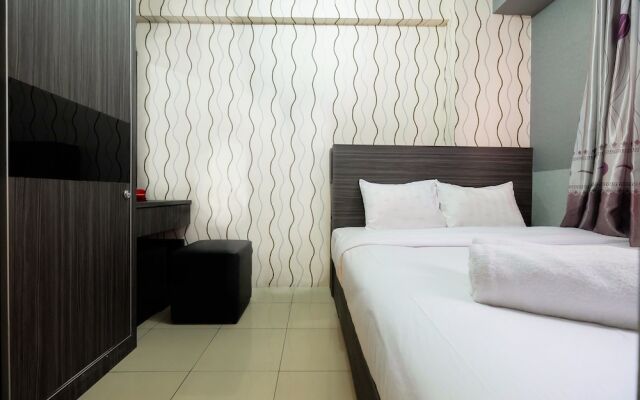 Monochrome Style 2 Bedrooms at Kalibata City Apartment By Travelio