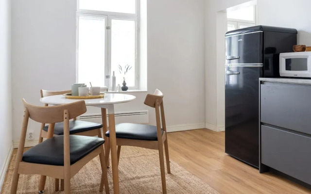 A bright wooden studio for four