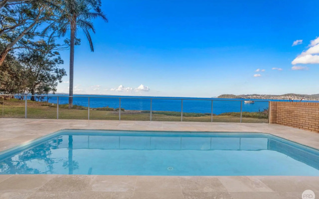 Seaside Sanctuary - Waterfront Luxury Home with Heated Pool