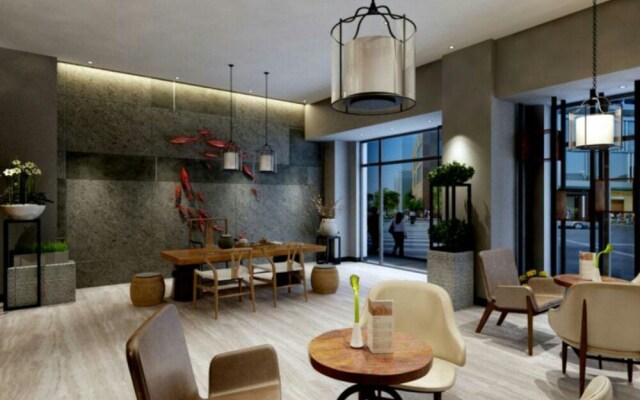 Yumi Apartment Xishuangbaina Branch