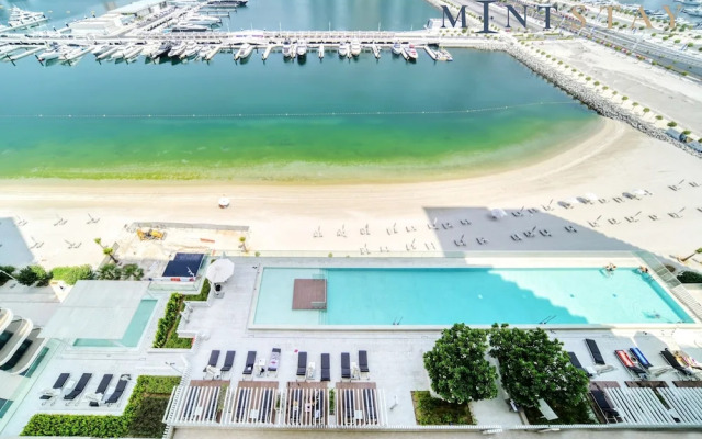 Elegant 2BR Emaar Beachfront Retreat