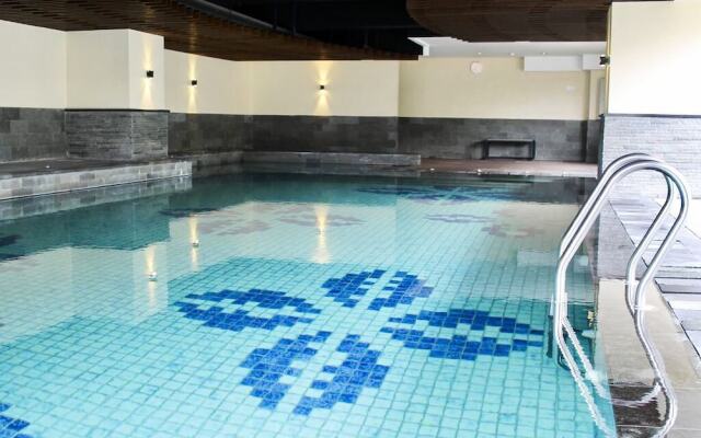 Pleasant and Homey 2BR Apartment at Tamansari La Grande