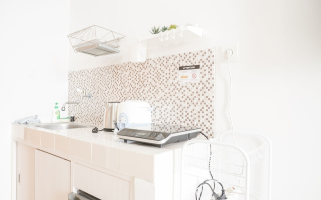 Homey and Cozy Living Studio Room at Dave Apartment