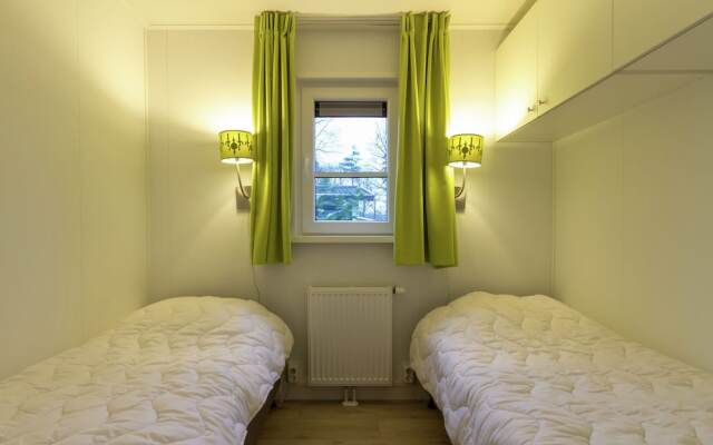 Modern chalet with two terraces and near a pond