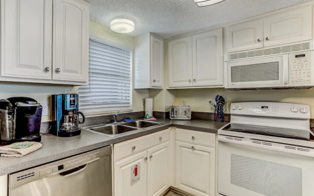 Oceanfront Beach Condo with Private Balcony, Short Walk to Pool and Beach by RedAwning