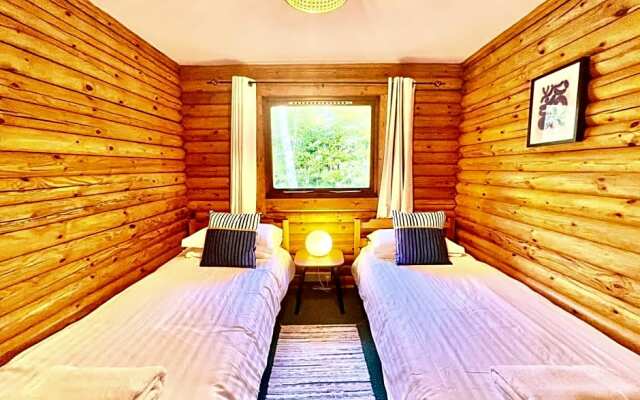 Riverside log cabins