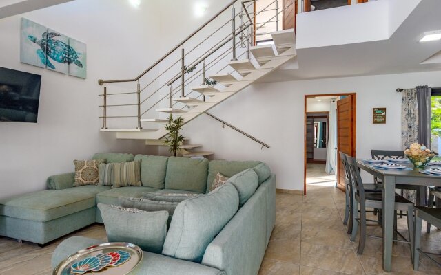 Ultramodern Townhome with an Inviting Coastal Design and Lush Outdoor Oasis with a Private Pool