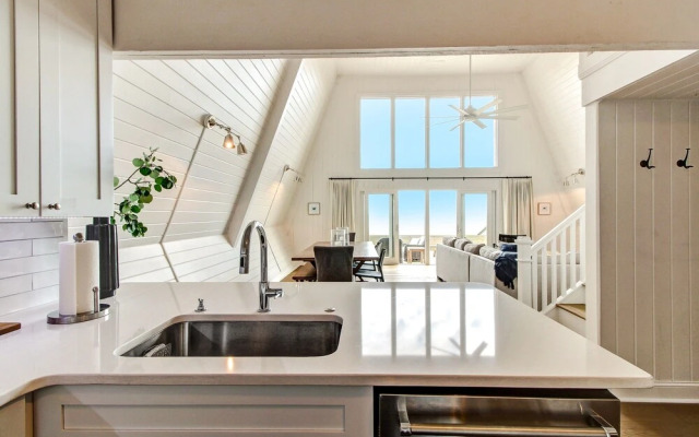 Roomy Chalet-Style Beachfront Condo with Private Beach Access by RedAwning
