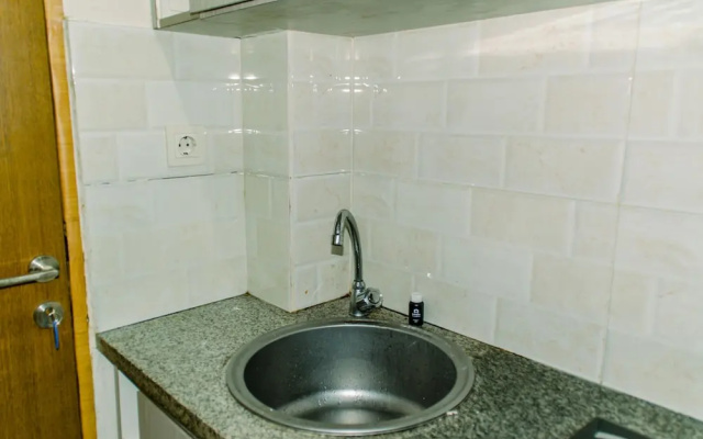 Homey And Warm Studio Room At Tifolia Apartment
