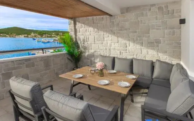 Seafront villa Kupinica with private indoor Pool