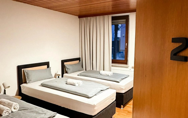 Suiteable Living - Boardinghaus mit Parkplätzen, WLAN und Waschraum