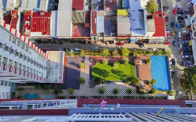 Comfy and Homey 2BR at Vida View Apartment By Travelio