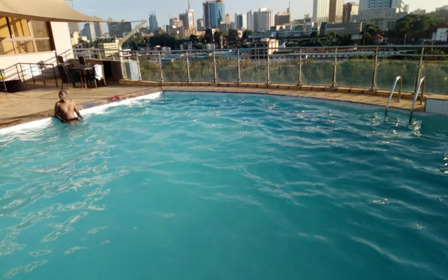 Rooftop pool with scenic city skyline view-studio