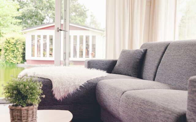 Beautiful Chalet in a Holiday Park by a Pond