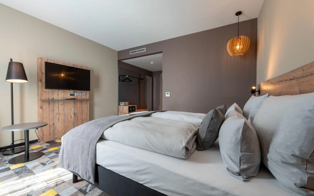 Отель Holiday Inn - the niu, Timber Esslingen, an IHG Hotel