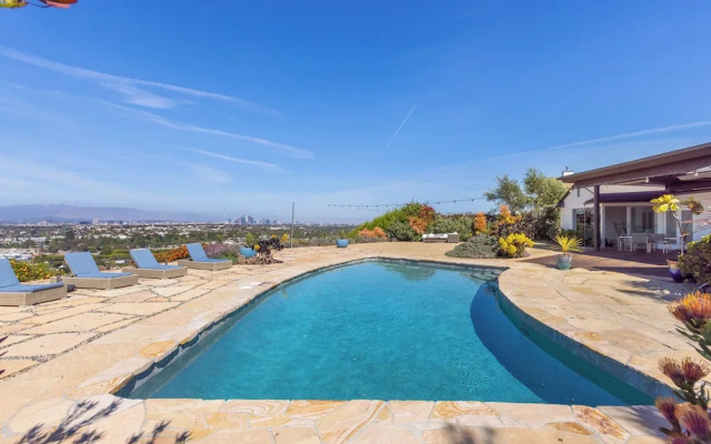 Stylish Hillside Retreat with Pool & Views