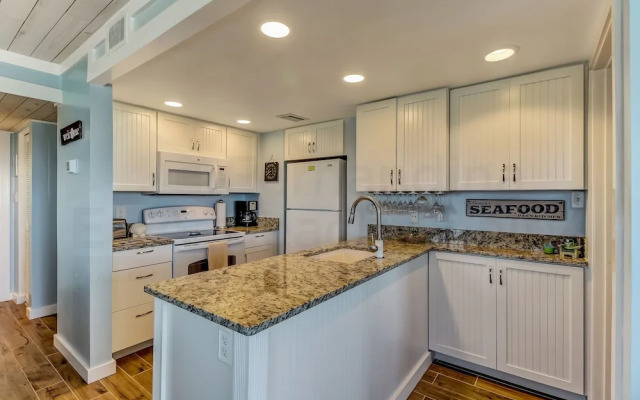 Newly Remodeled Oceanfront Condo with Salt Water Pool and Private Walkway to Beach by RedAwning
