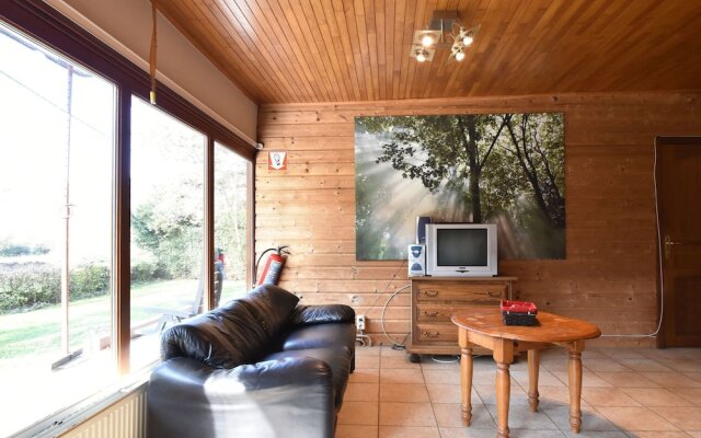 Nestled In A Green Scenery, This Chalet Along The River Is Perfect To Chill Out!