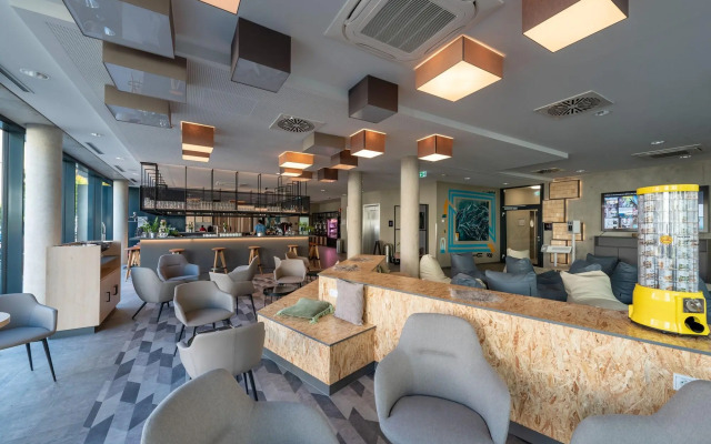 Отель Holiday Inn - the niu, Timber Esslingen, an IHG Hotel