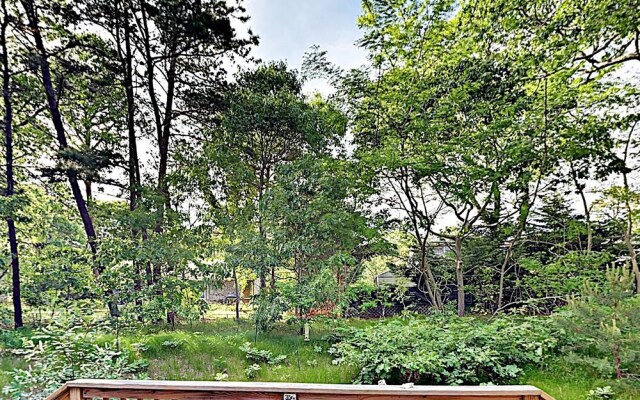 Woodsy Cape Cod Home by RedAwning