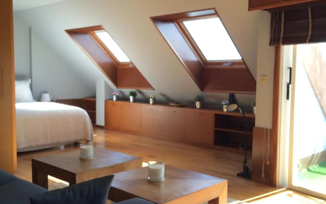 Attic loft to wake up by the sea.