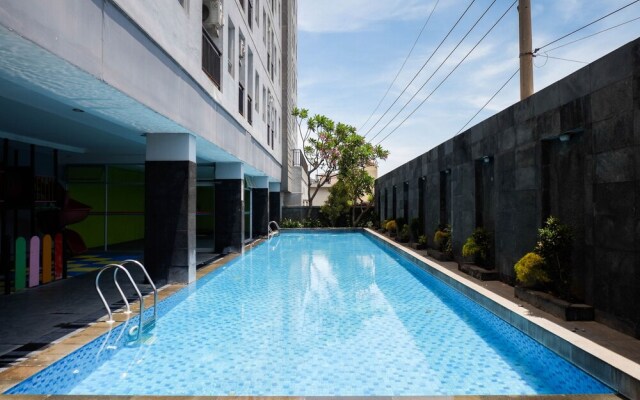 Homey And Tidy 2Br At Puri Mas Apartment