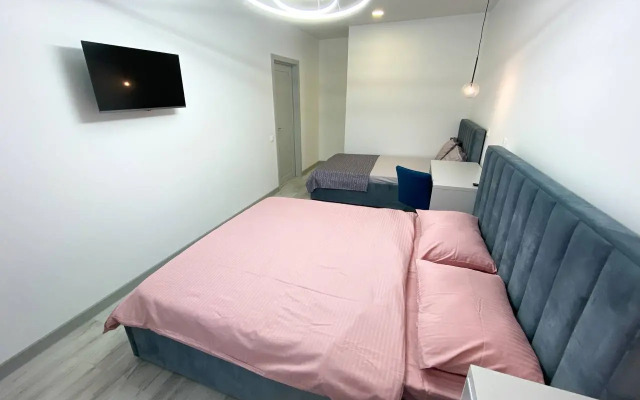 Апартаменты двухкомнатные с двумя кроватями, гардеробной и кухней-гостиной