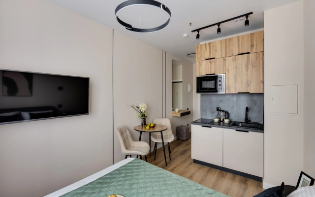 Апартаменты Уютная Студия у Метро Ботанический Сад