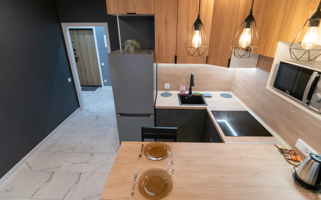 V Novostroye Na Troikh Apartments