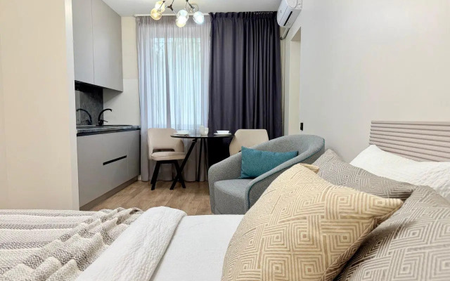 Современная студия в центре Апартаменты