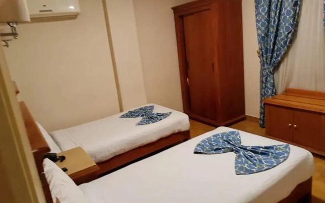 Отель Aura Inn Tiba Pyramids