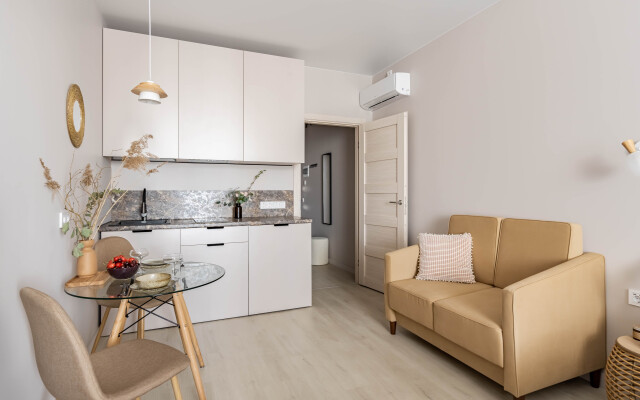 Bezhevye v tsentre s konditsionerom Apartments