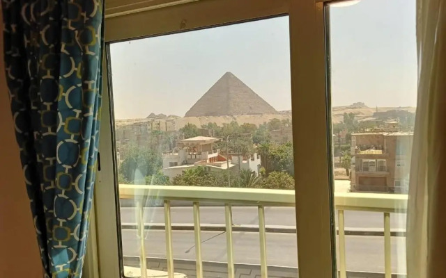 Отель Aura Inn Tiba Pyramids
