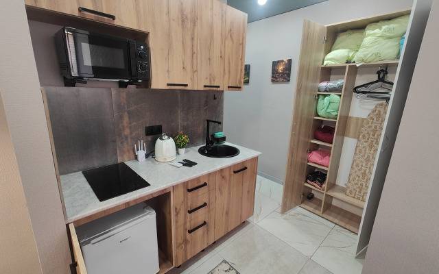 Апартаменты Потрясающая студия напротив терминала в центре Нефтяников